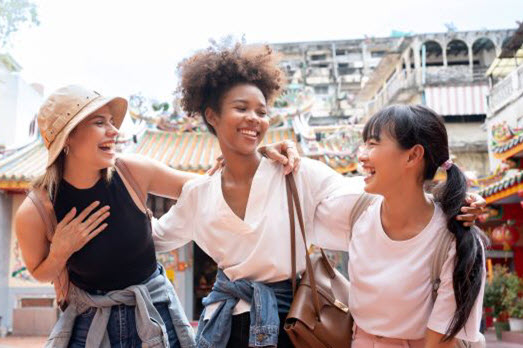 Image of a business woman carrying her suitecase